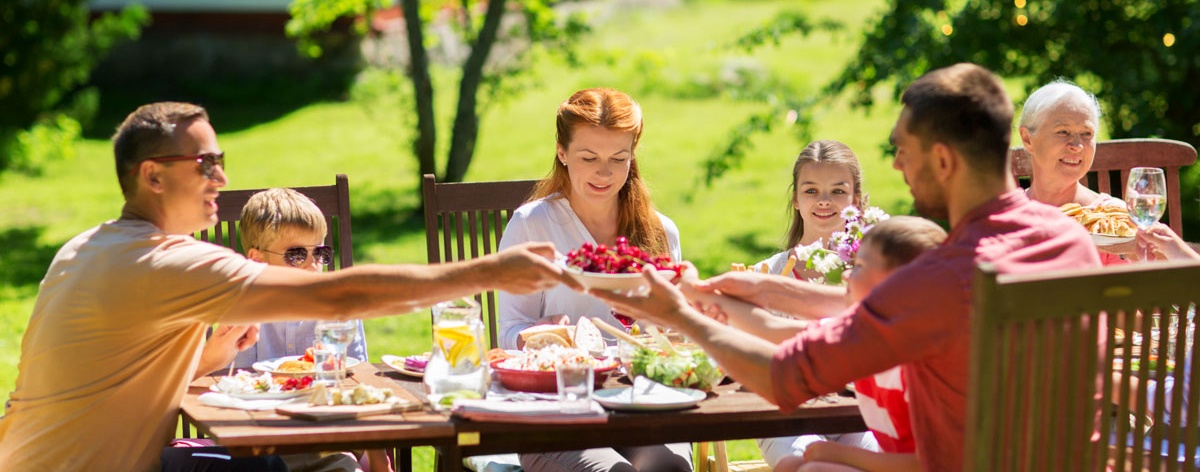happy family having dinner or summer garden party happy family having dinner or summer garden party